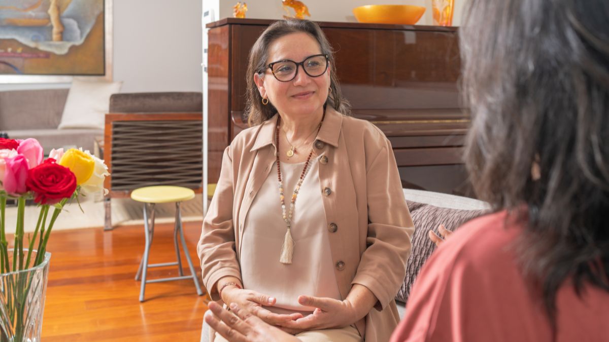 An acupuncturist having a consultation with her patient