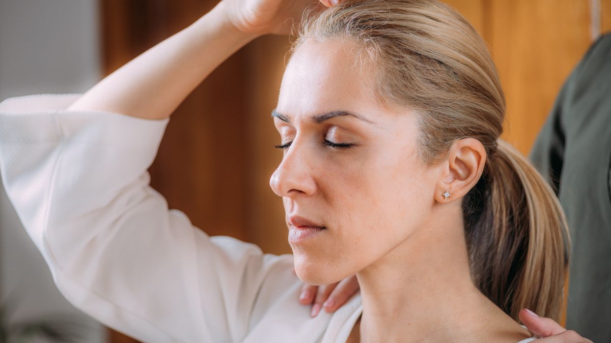 A photo of a woman being calmed down by her doctor behind her