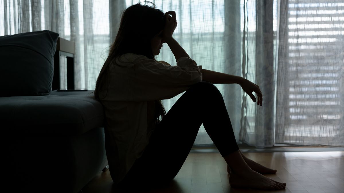 A woman sitting on the floor